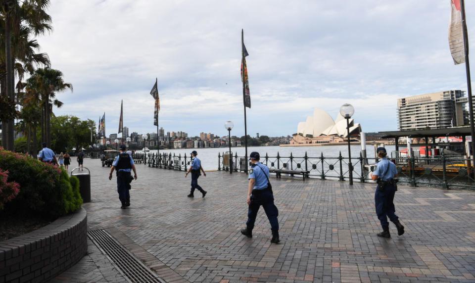 NSW Police patrol Circular Quay near the Sydney Opera House.