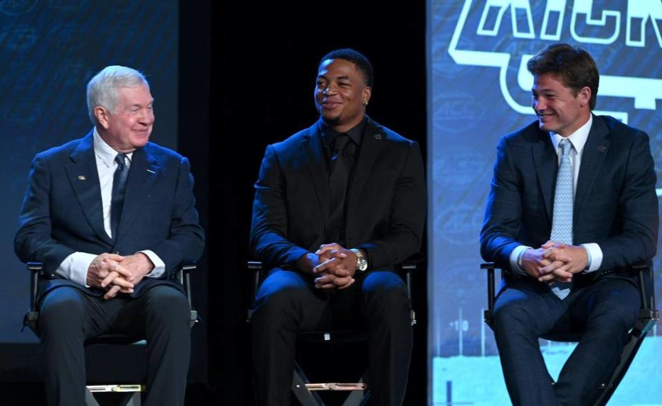 UNC Tar Heels head coach Mack Brown, linebacker Cedric Gray and quarterback Drake Maye smile as they listen to a response from tight end John Copenhaver during the third day of the ACC Kickoff event at the Westin Charlotte Hotel in Charlotte, NC on Thursday, July 27, 2023.