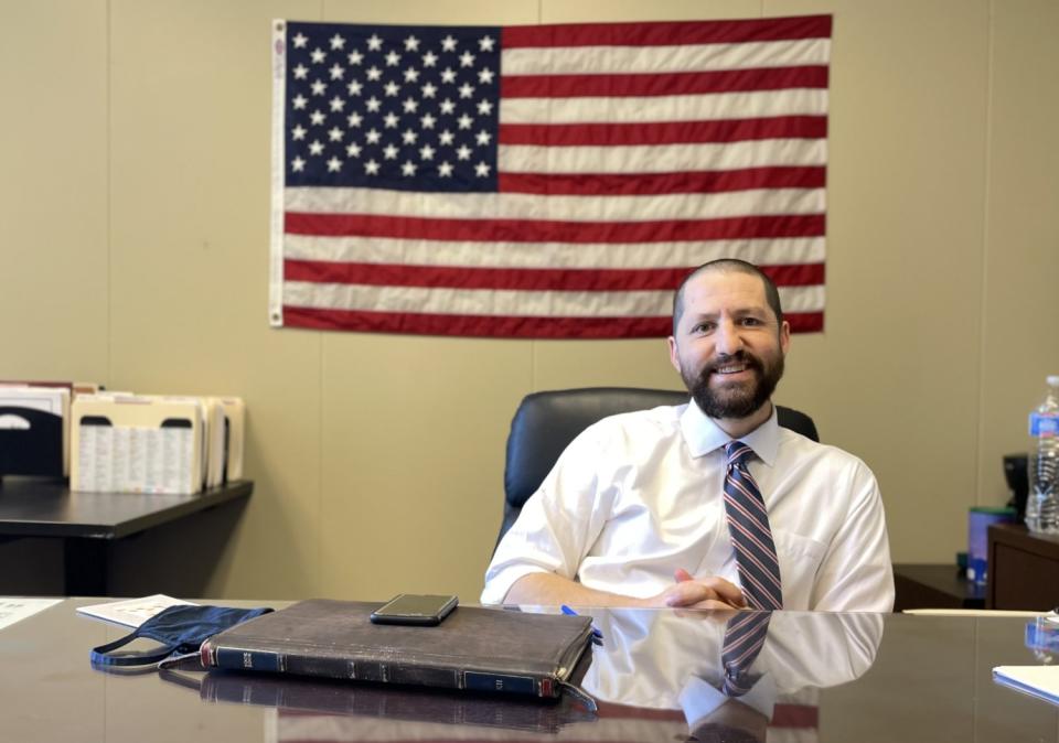 Republican Arizona state Sen. Paul Boyer seated behind a desk