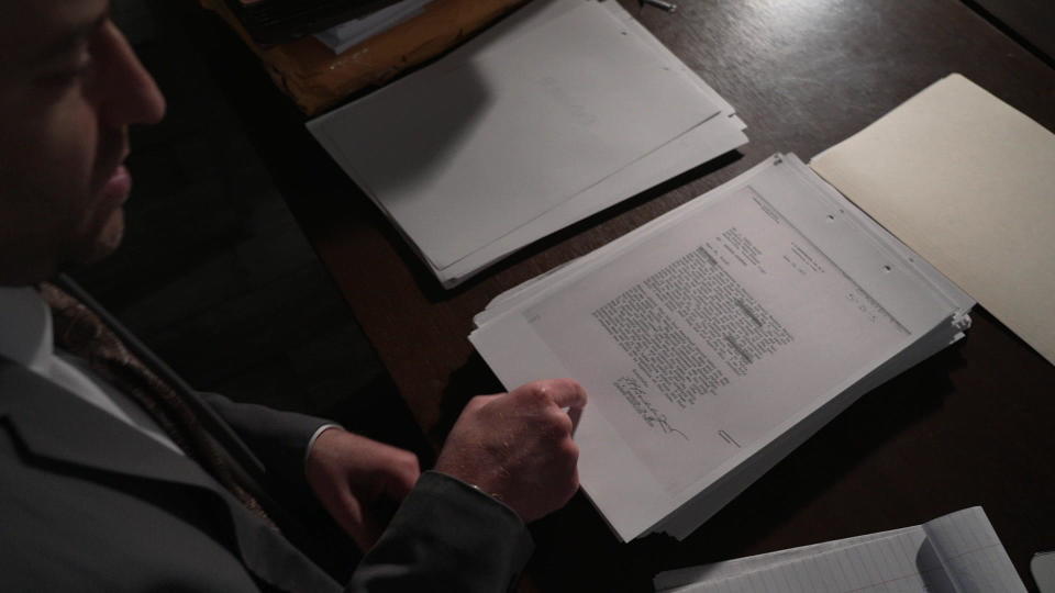 Defense attorney Justin Bonus reads a critical piece of evidence that was never seen at the trial. The report from a doctor who examined the Sanders twins two weeks after the reported rape which did not document any signs of sexual assault. / Credit: CBS News