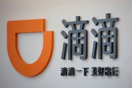 The logo of Didi Chuxing is seen at its headquarters in Beijing, China, May 18, 2016. REUTERS/Kim Kyung-Hoon/File Photo