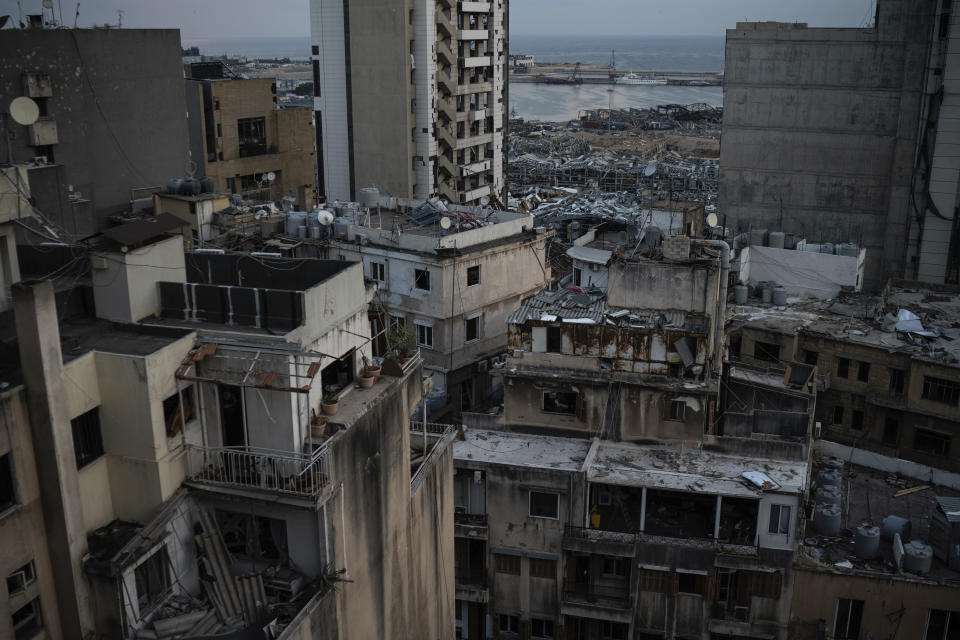 Damaged buildings are seen in a neighborhood near the site of last week's explosion that hit the seaport of Beirut, Lebanon, Tuesday, Aug. 11, 2020. (AP Photo/Felipe Dana)