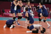 South Korean players celebrate winning the women's volleyball quarterfinal match between South Korea and Turkey at the 2020 Summer Olympics, Wednesday, Aug. 4, 2021, in Tokyo, Japan. (AP Photo/Frank Augstein)