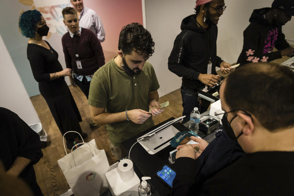 A person purchasing cannabis products at the Housing Works Cannabis Co., New York's first legal cannabis dispensary at 750 Broadway in Noho on Thursday, Dec. 29, 2022, in New York. Housing Works Cannabis Co. is a recipient of New York State's social equity license initiative and the first legal cannabis dispensary to open in the state. (AP Photo/Stefan Jeremiah)