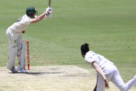 Australia's Steve Smith is hit while batting during play on day four of the fourth cricket test between India and Australia at the Gabba, Brisbane, Australia, Monday, Jan. 18, 2021. (AP Photo/Tertius Pickard)