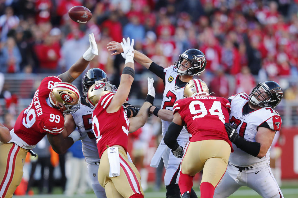 Atlanta Falcons quarterback Matt Ryan (2) passes as San Francisco 49ers defensive tackle DeForest Buckner (99), defensive end Nick Bosa (97) and defensive end Solomon Thomas (94) apply pressure during the first half of an NFL football game in Santa Clara, Calif., Sunday, Dec. 15, 2019. (AP Photo/John Hefti)