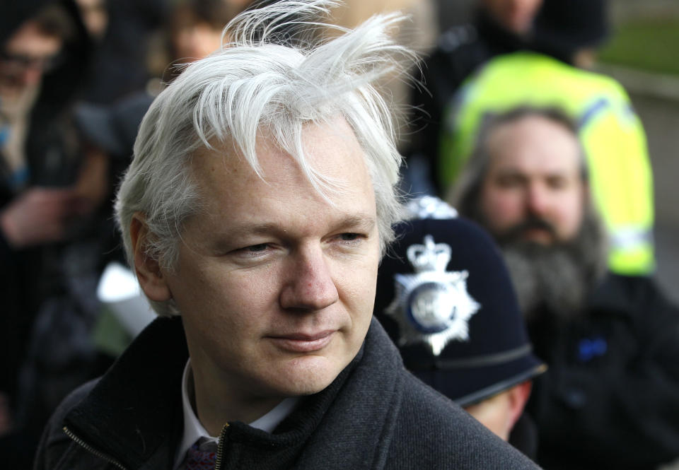 FILE - In this Feb. 1, 2012 file photo, Julian Assange, WikiLeaks founder, arrives at the Supreme Court in London. It has been two months since Assange ducked into Ecuador's London embassy to seek political asylum, and as the stalemate over Assange settled in Friday, Aug. 17, 2012, it appeared London's veiled threat that it could storm Ecuador's embassy and drag Assange out has backfired — drawing supporters to the mission where the WikiLeaks founder is holed up and prompting angry denunciations from Ecuador and elsewhere. (AP Photo/Kirsty Wigglesworth, File)