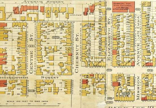 An antique sanborn fire insurance map with red and yellow buildings.