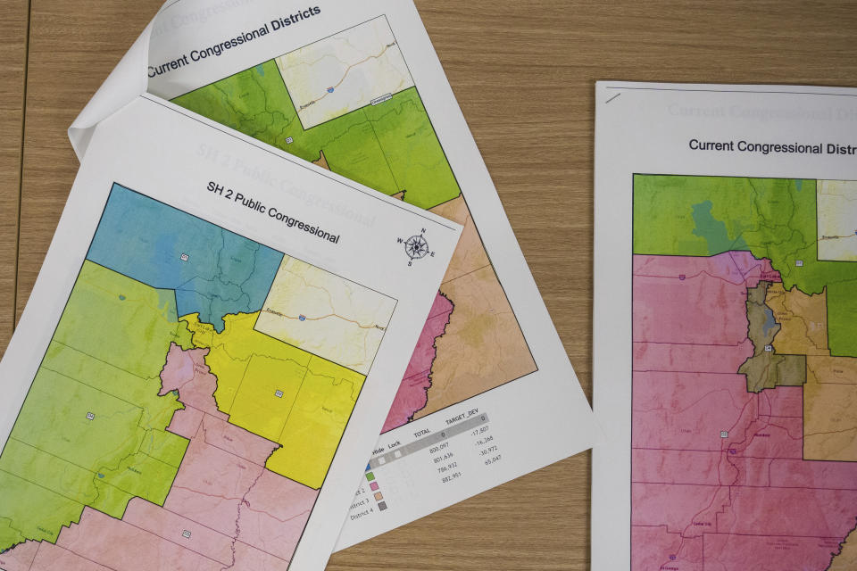 Maps at a news conference held by the Utah's bipartisan redistricting panel in Taylorsville, Utah on Tuesday, Oct. 26, 2021. (Trent Nelson/The Salt Lake Tribune via AP)