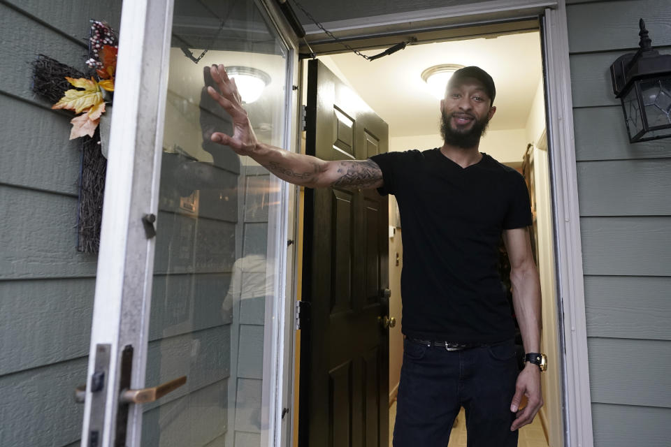 Richard Coleman II poses in his home in Richmond, Va., Thursday, Feb. 11, 2021. Coleman said he was asked to leave four jobs and was taken out of the running for at least six others because of his convictions for possessing a fraction of an ounce of marijuana, once as a college student in 2003 and a second time a few years later. (AP Photo/Steve Helber)