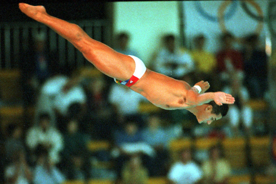 FILE - In this Sept. 26, 1988, file photo, Greg Louganis, of the United States, performs in the men's preliminary 10-meter platform diving competition at the XXIV Summer Olympic Games in Seoul, South Korea. (AP Photo/Ed Reinke, File)