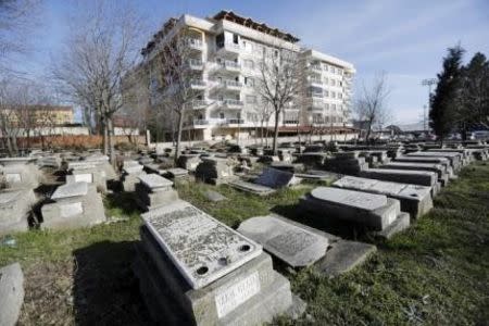 An abandoned Jewish cemetery is pictured in Edirne, western Turkey, February 26, 2015. When the domes of Edirne's abandoned Great Synagogue caved in, Rifat Mitrani, the town's last Jew, knew it spelled the end of nearly two millennia of Jewish heritage in this Turkish town. As a boy, Mitrani studied Hebrew in the synagogue's gardens and, in the 1970s, dispatched its Torah to Istanbul after the community shrank to just three families. In 1975, he unlocked its doors and swept away the cobwebs to marry his wife Sara.Now a five-year, $2.5 million government project has restored the synagogue's lead-clad domes and resplendent interior ahead of its Thursday re-opening, the first temple to open in Turkey in two generations, but one without worshippers. It is part of a relaxation of curbs on religious minorities ushered in during President Tayyip Erdogan's 12 years in power. Yet it coincides with a spike in anti-Semitism in predominantly Muslim Turkey and a wave of Jews moving away, say members of the aging community, which has shrunk by more than a third in the last quarter century. Picture taken February 26, 2015. REUTERS/Murad Sezer