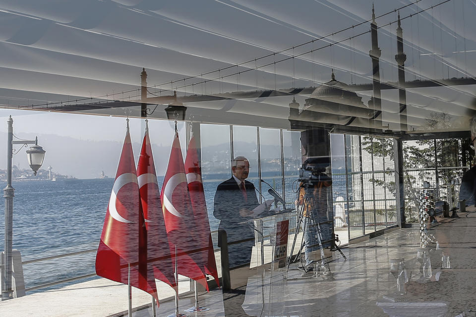 FILE - Kemal Kilicdaroglu, center, leader of Turkey's main opposition Republican People's Party, CHP, speaks at a news conference with the Bosporus in the background in Istanbul, on Friday, April 14, 2017. Kilicdaroglu, the main challenger to President Recep Tayyip Erdogan in the May 14 election, cuts a starkly different figure than the incumbent who has led the country for two decades. As the polarizing Erdogan has grown increasingly authoritarian, Kilicdaroglu has a reputation as a bridge builder and vows to restore democracy. (AP Photo/ Emrah Gurel, File)