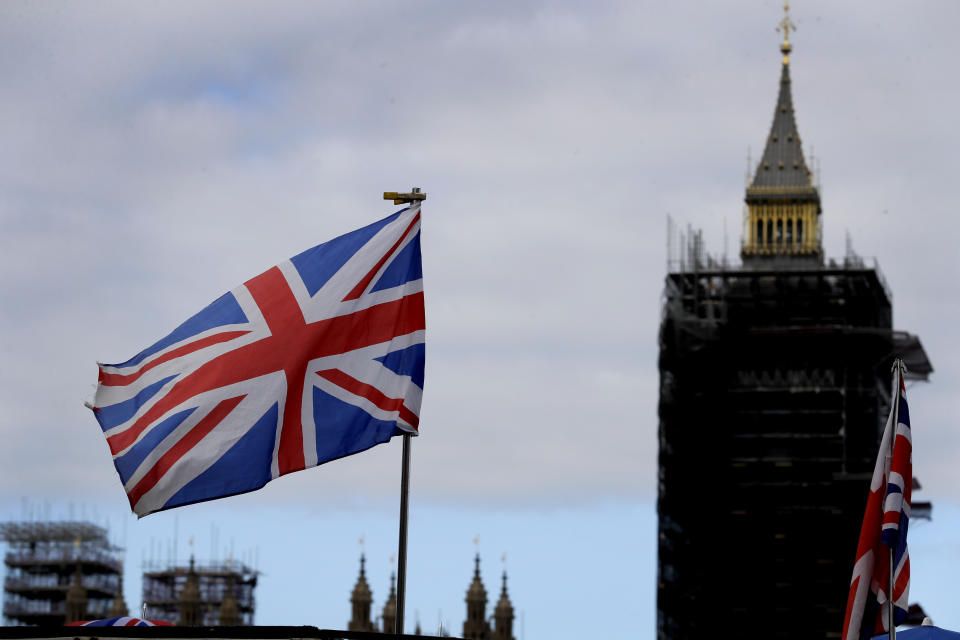 The Union flag flies above a souvenir stand in front of Big Ben in London, Friday, Oct. 16, 2020. Britain’s foreign minister says there are only narrow differences remaining in trade talks between the U.K. and the European Union. But Dominic Raab insists the bloc must show more “flexibility” if it wants to make a deal. (AP Photo/Kirsty Wigglesworth)