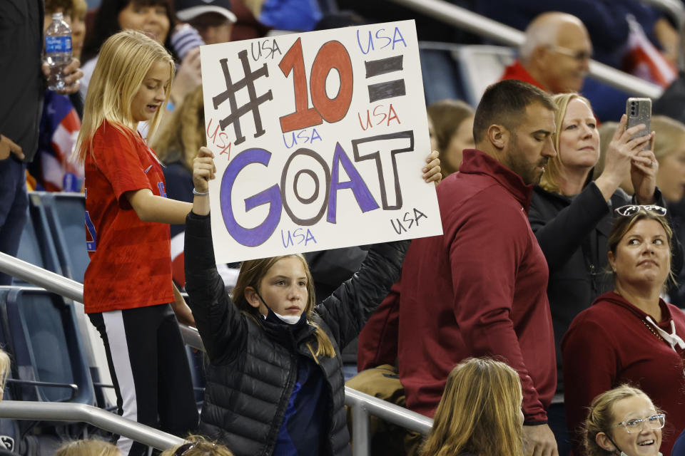 A young fan holds a sign supporting United States forward Carli Lloyd before a international friendly soccer match against South Korea in Kansas City, Kan., Thursday, Oct. 21, 2021. (AP Photo/Colin E. Braley)