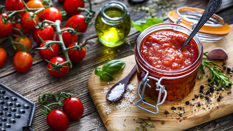 jar of tomato sauce and ingredients