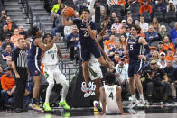 Virginia forward Kadin Shedrick (21) gets a rebound against Baylor during the first half of an NCAA college basketball game Friday, Nov. 18, 2022, in Las Vegas. (AP Photo/Chase Stevens)
