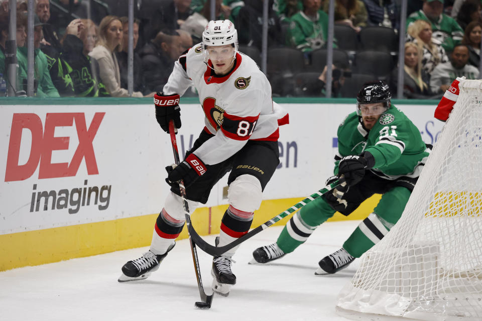 Ottawa Senators left wing Dominik Kubalik (81) protects the puck from Dallas Stars center Tyler Seguin (91) during the first period of an NHL hockey game in Dallas, Friday, Dec. 15, 2023. (AP Photo/Michael Ainsworth)