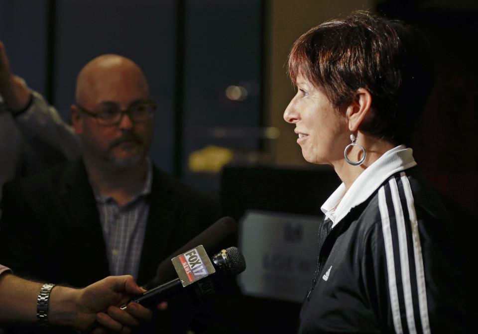 Notre Dame coach Muffet McGraw answers questions after arriving at the team hotel for the NCAA women's Final Four college basketball tournament, Thursday, April 3, 2014, in Nashville, Tenn. Notre Dame is scheduled to play Maryland on Sunday in the semifinals. (AP Photo/Mark Humphrey)