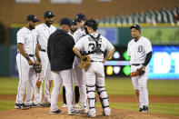 Detroit Tigers manager A.J. Hinch confers with starting pitcher Casey Mize during the sixth inning of a baseball game against the Kansas City Royals, Wednesday, May 12, 2021, in Detroit. (AP Photo/Carlos Osorio)