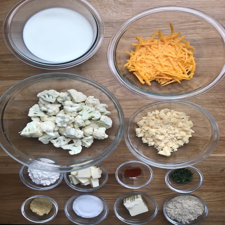 Ingredients for mac 'n' cheese in small bowls.