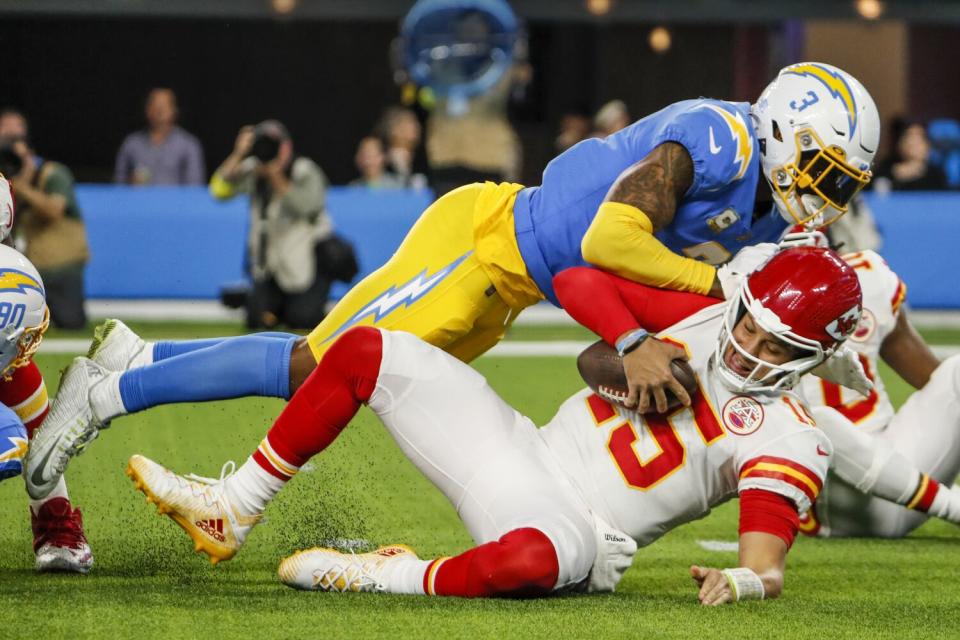 Chargers safety Derwin James Jr. (3) tackles Kansas City Chiefs quarterback Patrick Mahomes (15) in November.