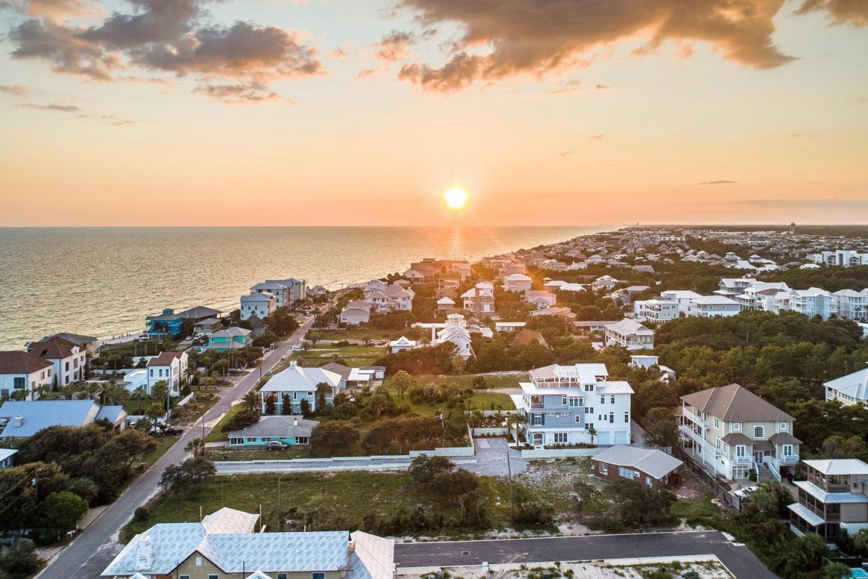 Sunrise over the ocean and beachfront homes in Inlet Beach florida