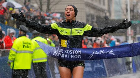 Desiree Linden of the U.S. crosses the finish line to win the women's division of the 122nd Boston Marathon in Boston, Massachusetts, U.S., April 16, 2018. REUTERS/Brian Snyder