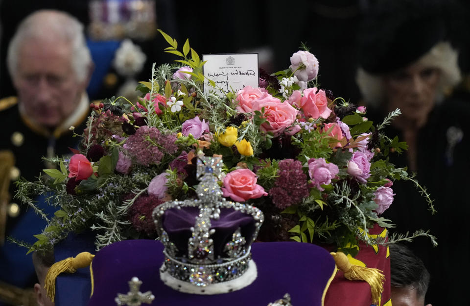 FILE - Britain's King Charles III, left, and Camilla, the Queen Consort follow the coffin of Queen Elizabeth II as it is carried out of Westminster Abbey during her funeral in central London, Monday, Sept. 19, 2022. (AP Photo/Frank Augstein, Pool, File)