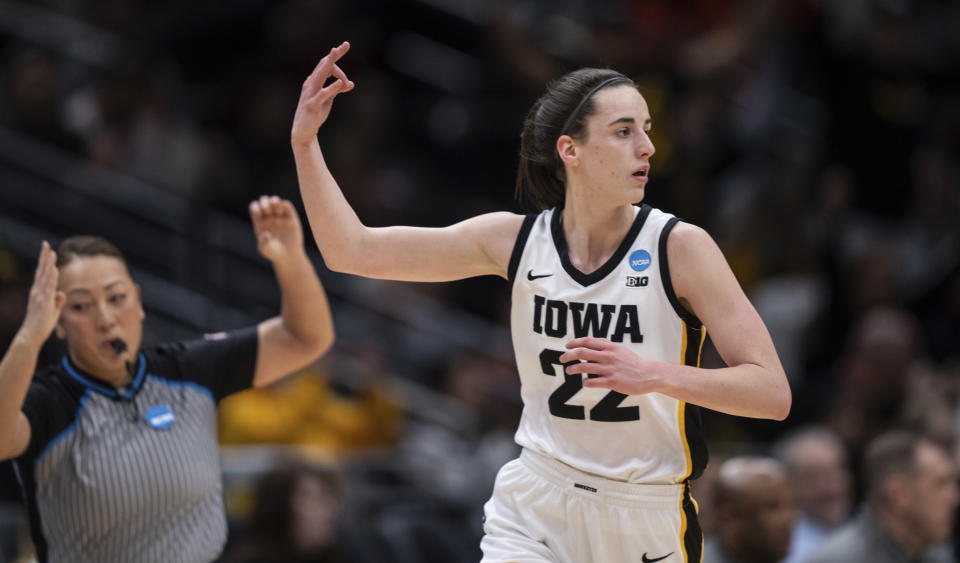 Iowa guard Caitlin Clark gestures after making a 3-point basket during the first half of a Sweet 16 college basketball game against Colorado in the women's NCAA tournament Friday, March 24, 2023, in Seattle. (AP Photo/Stephen Brashear)