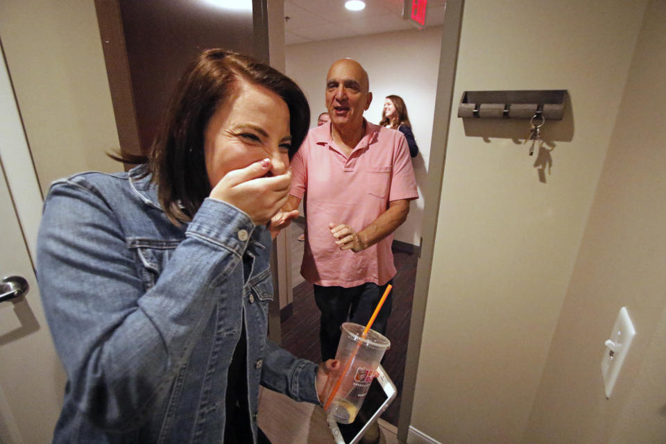 ADDS MORE INFORMATION ON SUBJECT - Elliot Frank, right, the president of Autism Housing Development Corporation of Pittsburgh, and Alexis Reighard, a personal aide to a resident at the David Wright apartments, share a laugh during a tour of the apartment complex in Heidelberg, Pa., Thursday, March 30, 2017. Innovative housing developments like this are popping up across the U.S. to serve those who were diagnosed with autism spectrum disorder as children amid increased awareness about the disorder and changes in how it's defined. ( Photo/Gene J. Puskar)