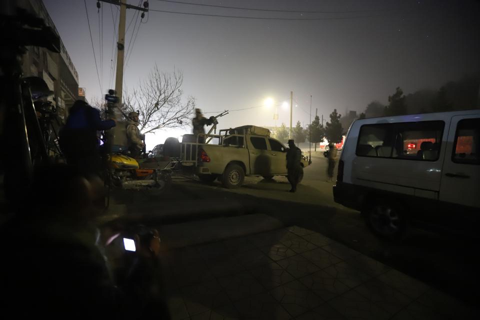 <p>Afghan security officials take up positions near the scene of attack by armed men at an upscale hotel in Kabul, Afghanistan on January 20, 2018. (Photo: Jawad Jalali/EPA-EFE/REX/Shutterstock) </p>