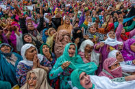 Kashmiri Muslim women pray as a head priest displays the holy relic believed to be the whisker from the beard of the Prophet Mohammed on the occasion of the Muslim festival Mehraj-u-Alam, which marks ascension day, the journey from earth to heavens of the Prophet Mohammed, at the Hazratbal Shrine on May 5, 2016 in Srinagar, the summer capital of Indian administered Kashmir, India. (Yawar Nazir/Getty Images)