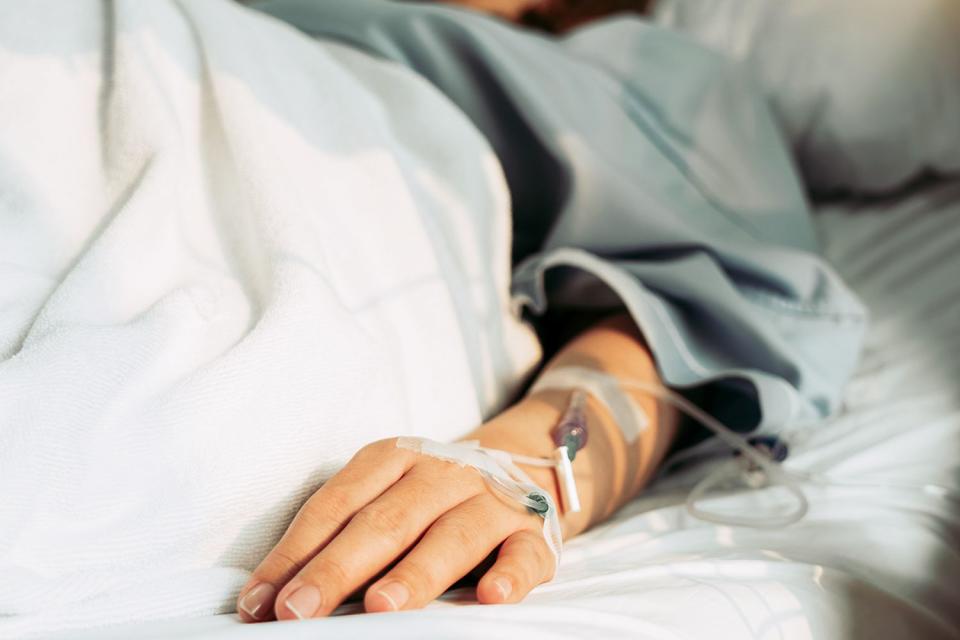 <p>Getty</p> A woman lies in a hospital bed.