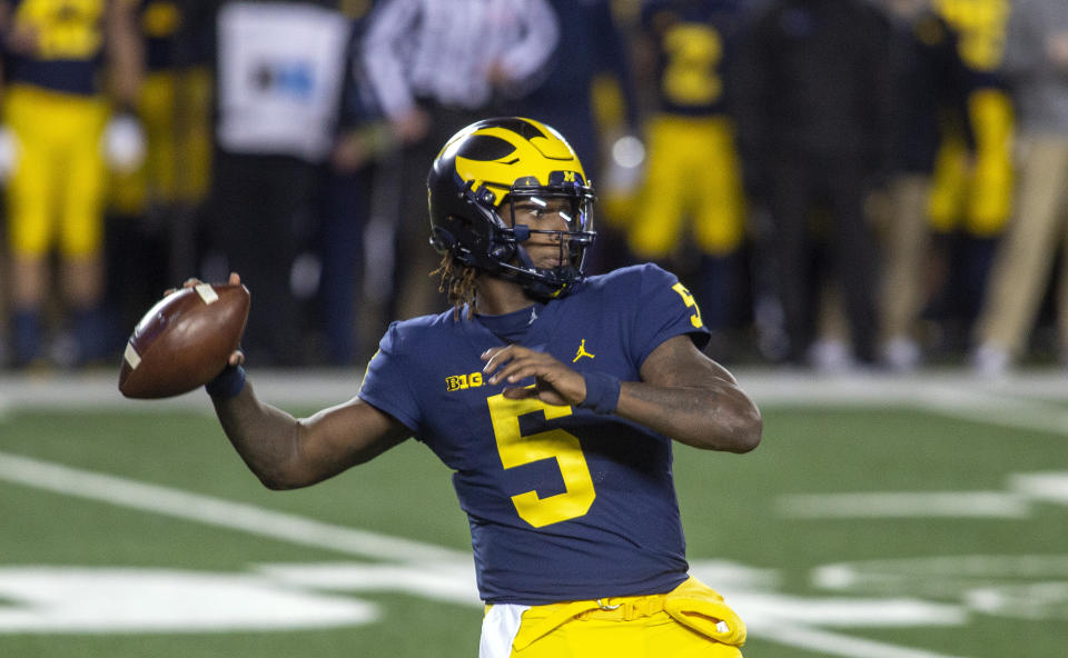 Michigan quarterback Joe Milton (5) throws a pass in the first quarter of an NCAA college football game against Wisconsin in Ann Arbor, Mich., Saturday, Nov. 14, 2020. (AP Photo/Tony Ding)