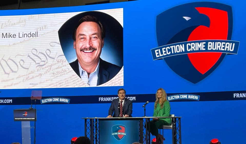 Mike Lindell speaks with Emerald Robinson, a correspondent on conservative platform Lindell TV, at the Election Crime Bureau Summit in Springfield on Aug. 16, 2023.