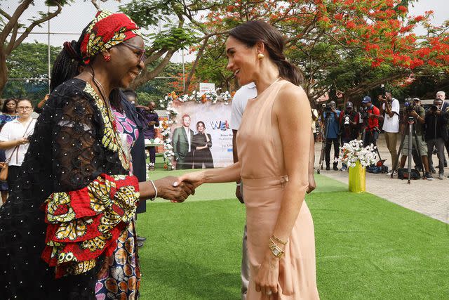 <p>Andrew Esiebo/Getty</p> Meghan Markle visits the Lightway Academy in Abuja, Nigeria