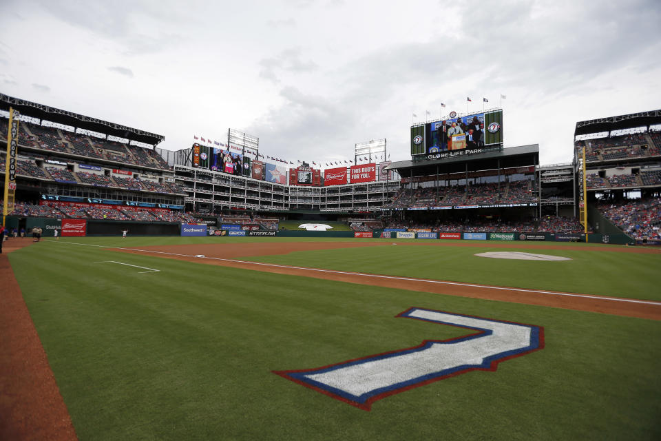 FILE - The jersey number of former Texas Rangers player Ivan Rodriguez is painted on the field for a ceremony where the number was retired by the ball club before a baseball game against the Houston Astros in Arlington, Texas, Aug. 12, 2017. Major League Baseball is playing its All-Star Game in Arlington for the first time since 1995, when the Rangers played outside in the stifling heat. This year's game will be played Tuesday, July 16, 2024, in their stadium with a retractable roof that opened in 2020. (AP Photo/Brandon Wade, File)