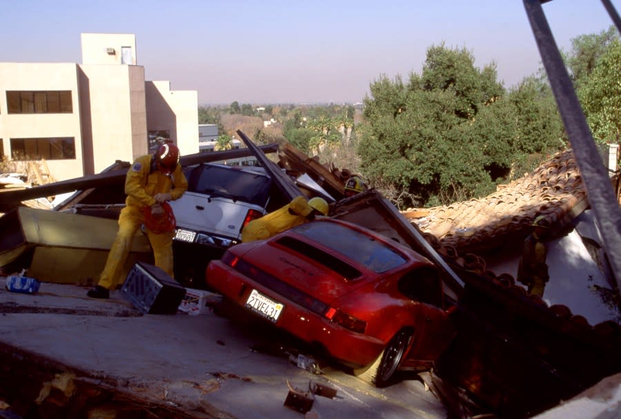 LOS ANGELES, CA – JANUARY 17: Fire and rescue teams search a house that collapsed after the 1994 Northridge earthquake on January 17, 1994 in Los Angeles, California. The 1994 Northridge earthquake was a moment magnitude 6.7, blind thrust earthquake that occurred on the annual Martin Luther King, Jr. Day holiday, on Monday, January 17, 1994. It occurred at 4:30:55 a.m. and was located in the San Fernando Valley region in the County of Los Angeles. (Photo by Bill Nation/Sygma via Getty Images)