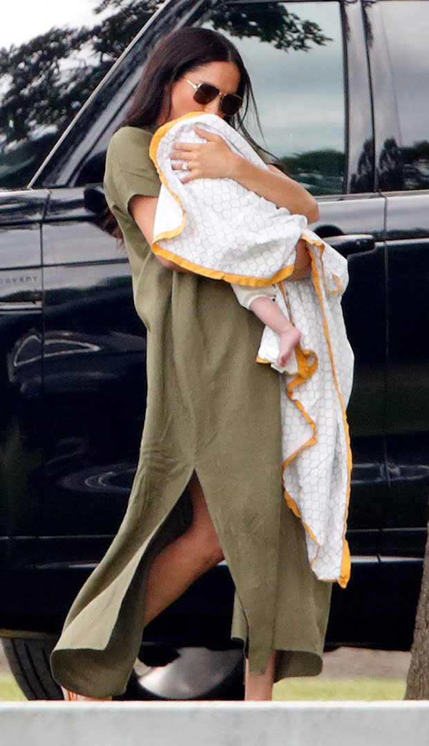 The new mother chose a khaki dress by Lisa Marie Fernandez (approximately £476) for a day at the polo. She completed the look with aviator sunglasses. [Photo: Getty]