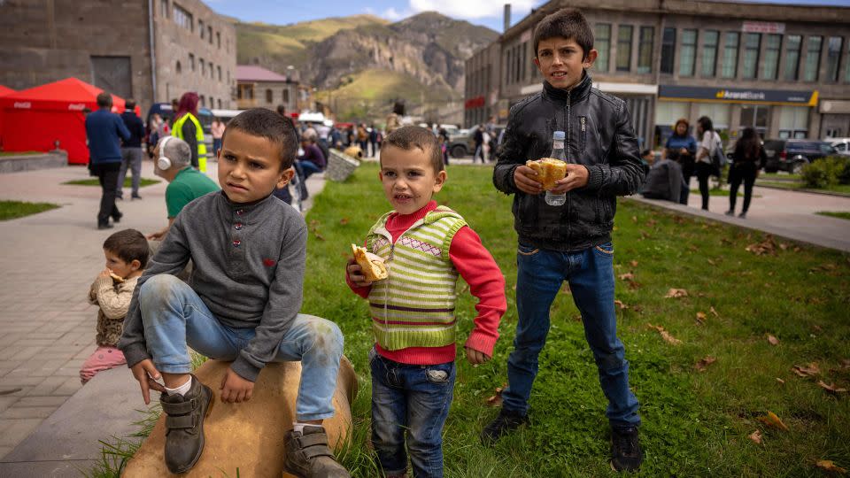 Armenian children wait outside a registration center in Goris, Armenia, while their parents stand in line, on September 27, 2023. - Anthony Pizzoferrato/Middle East Images/AFP/Getty Images