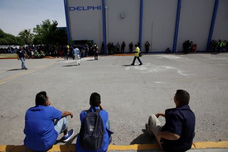 Employees of automotive supplier Delphi are pictured during a shift change in Ciudad Juarez, Mexico, April 25, 2017. REUTERS/Jose Luis Gonzalez