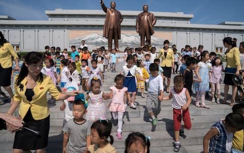 Even North Korean school children are not spared forced labour  - Credit: Andrew Harnik/AP
