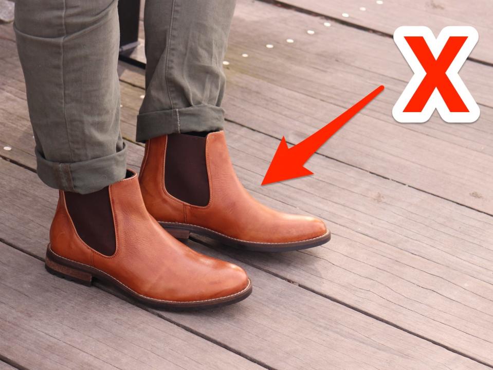 Chelsea boots with an "x" pointed at them.