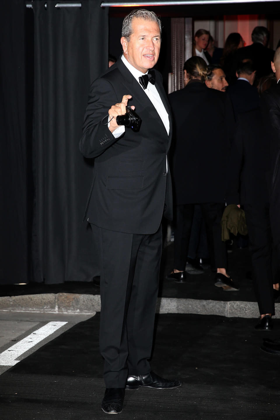 Legendary photographer Mario Testino hits the Vogue Paris 95th anniversary party.