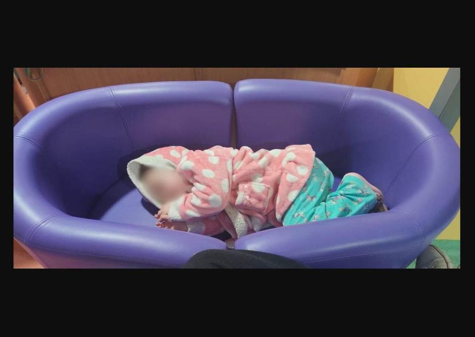 Violet Barker asleep on a makeshift bed at Royal Stoke Hospital last week (David Barker)