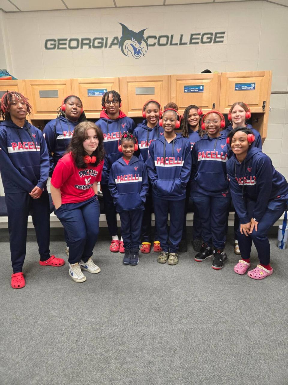 Pacelli girls basketball players pose for a photo at Georgia College & State University, where they beat First Presbyterian Day 55-48 in the GIAA Class AAAA state semifinals Feb. 29, 2024.
