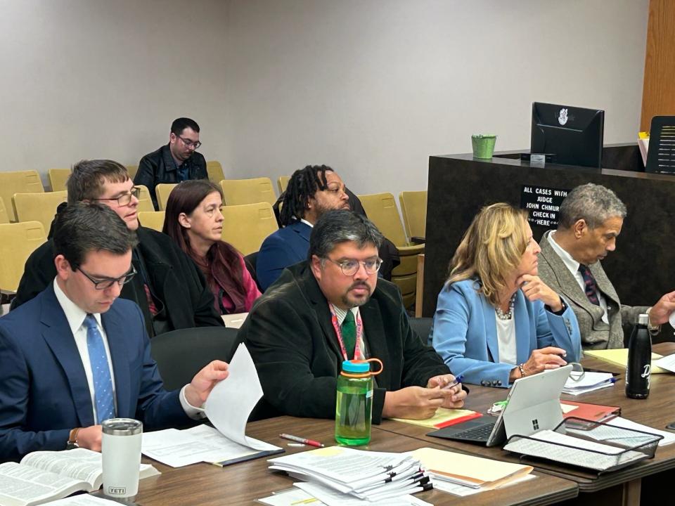 Shawn and Jamie Wilmoth and Willie Reed, sitting next to each other behind a row of attorneys, appear for their preliminary exams Jan. 10, 2024, in 37th District Court in Warren. They are accused in a fraudulent nominating petition signature case for 2022 candidates.