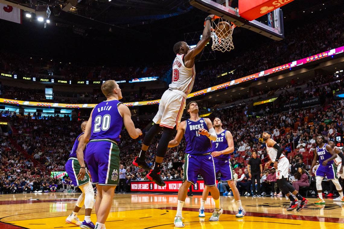 Miami Heat center Bam Adebayo (13) dunks the ball over Milwaukee Bucks center Brook Lopez (11) during the second half of an NBA game at Miami-Dade Arena in Downtown Miami, Florida, on Saturday, January 14, 2023.