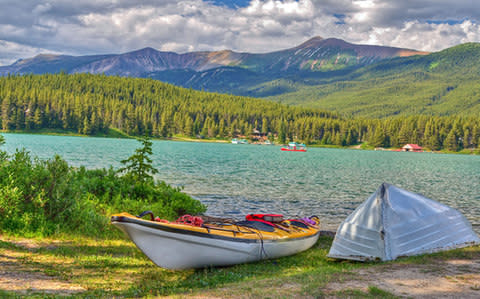 Kayaking in Maligne Lake, Canada - Credit: AP